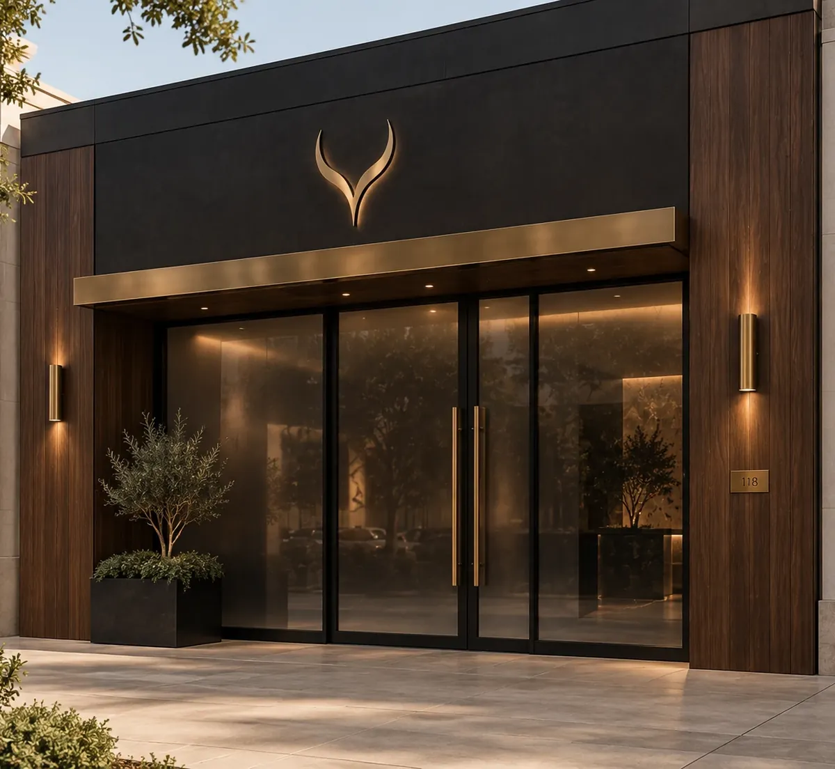 The street entrance of an EYEGASMIC Club Walk-Up with the brass sign above glass doors.